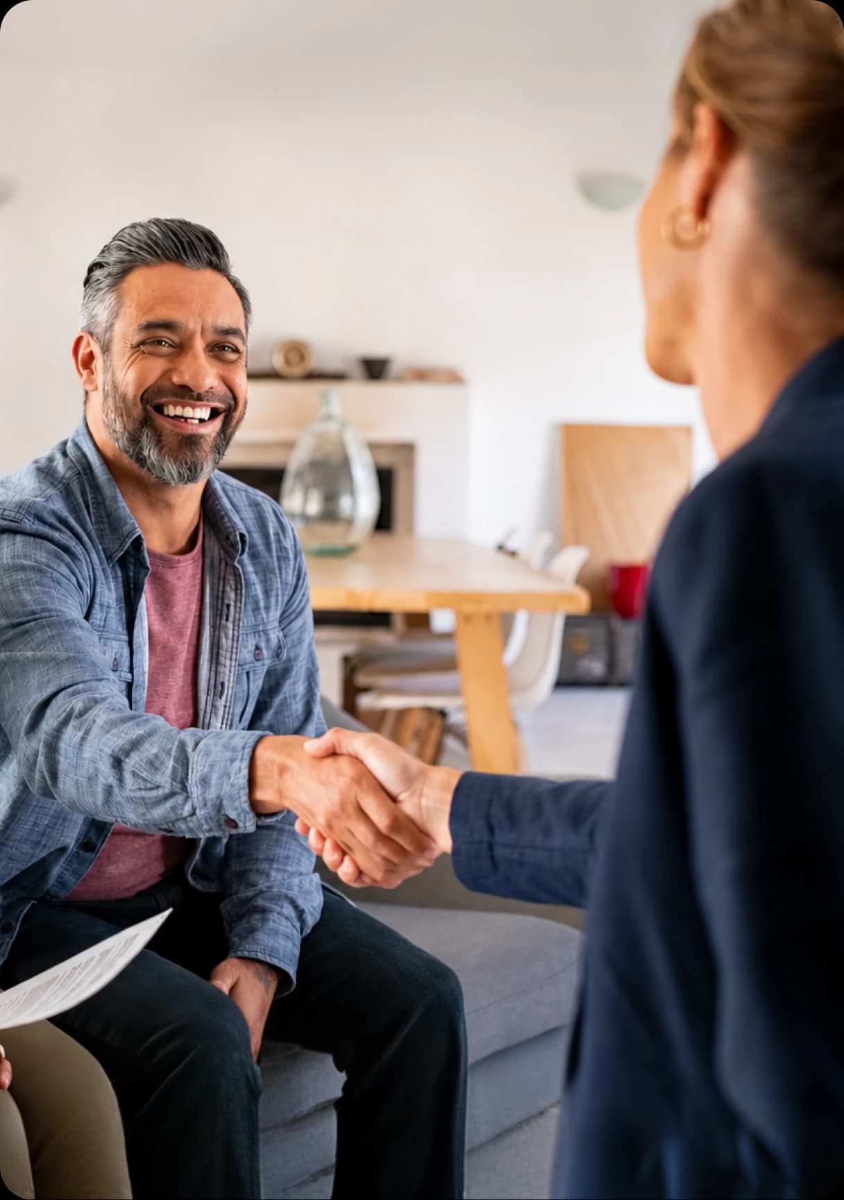 A clinician and patient shaking hands