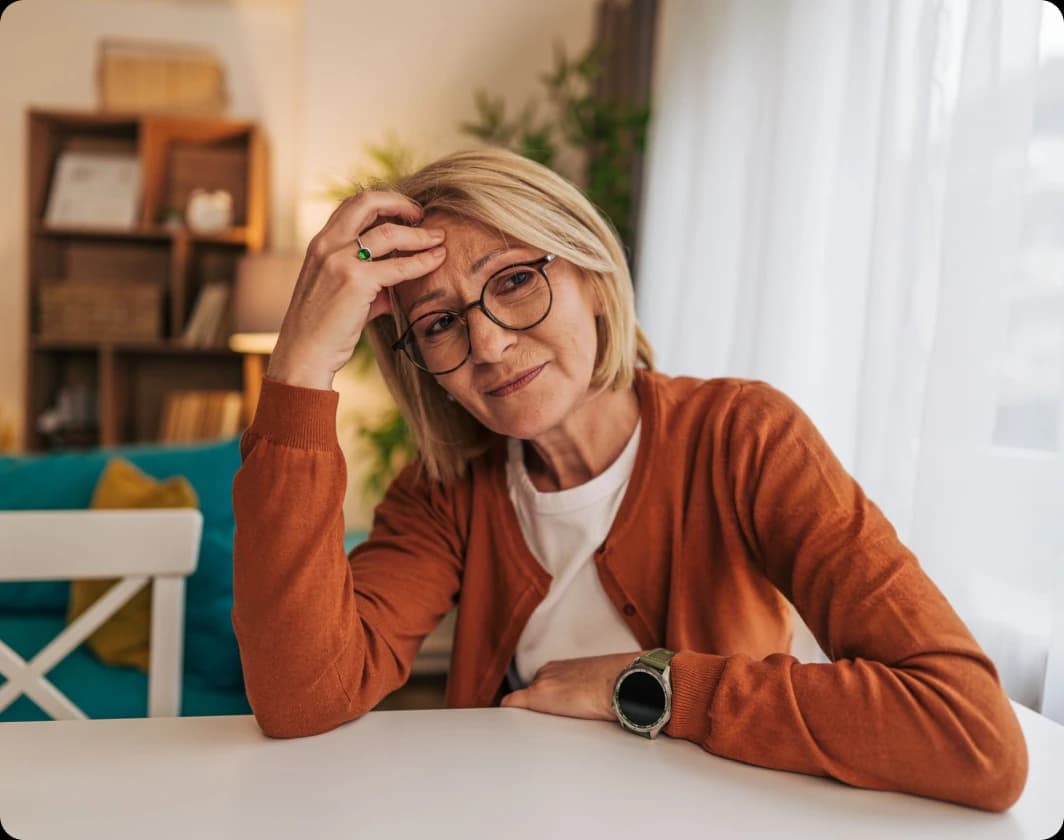 Woman feeling overwhelmed at her desk