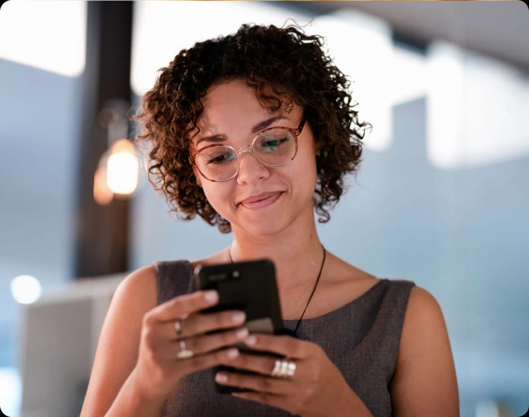 Woman comfortably checking her phone