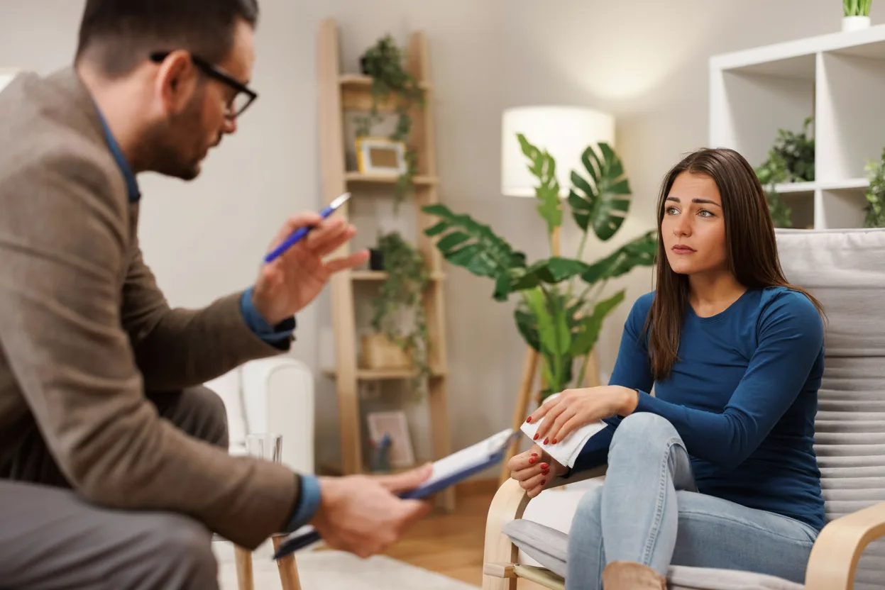 Physician speaking with a patient during an OCD assessment