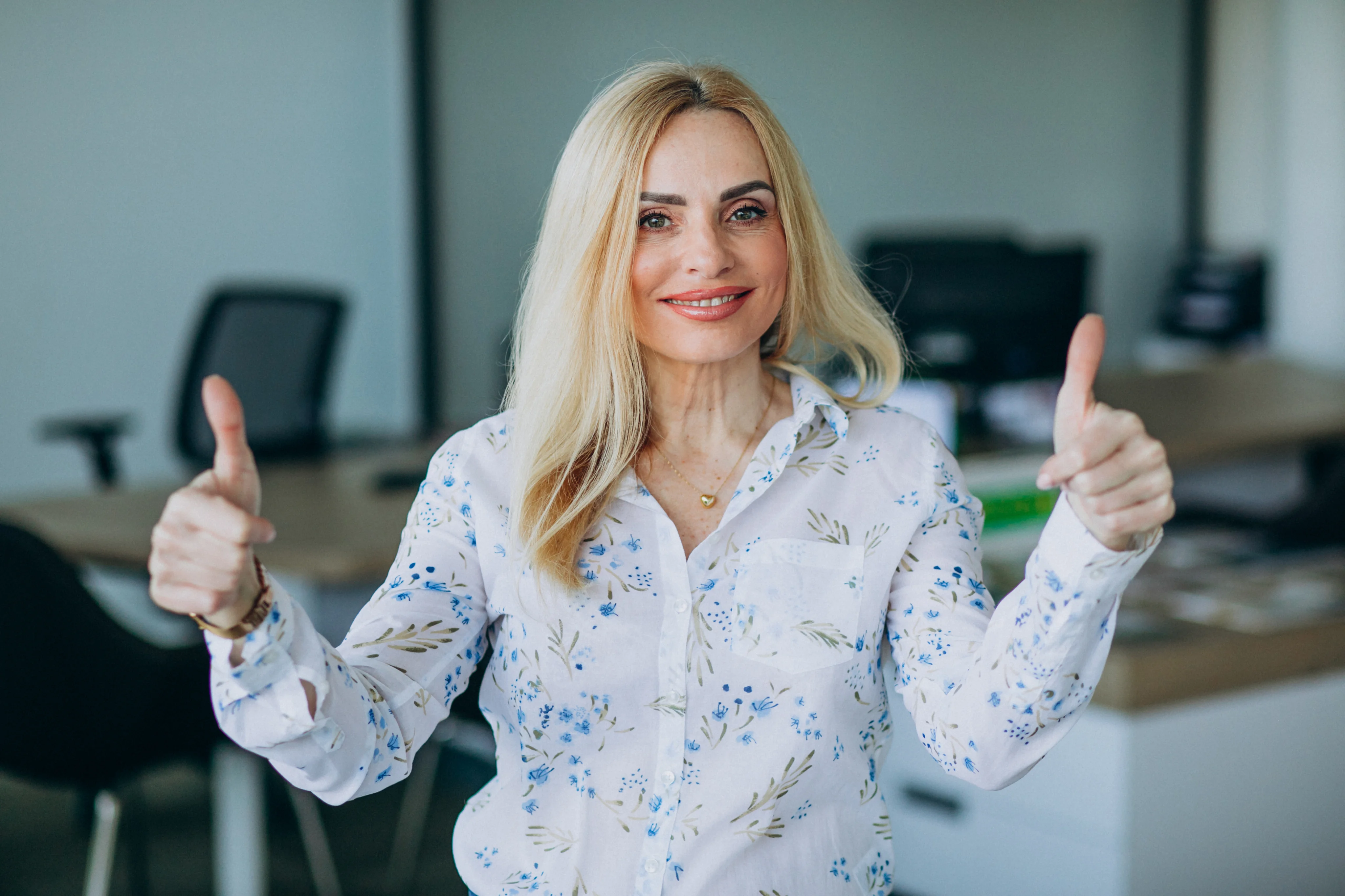 Smiling counsellor giving a thumbs up