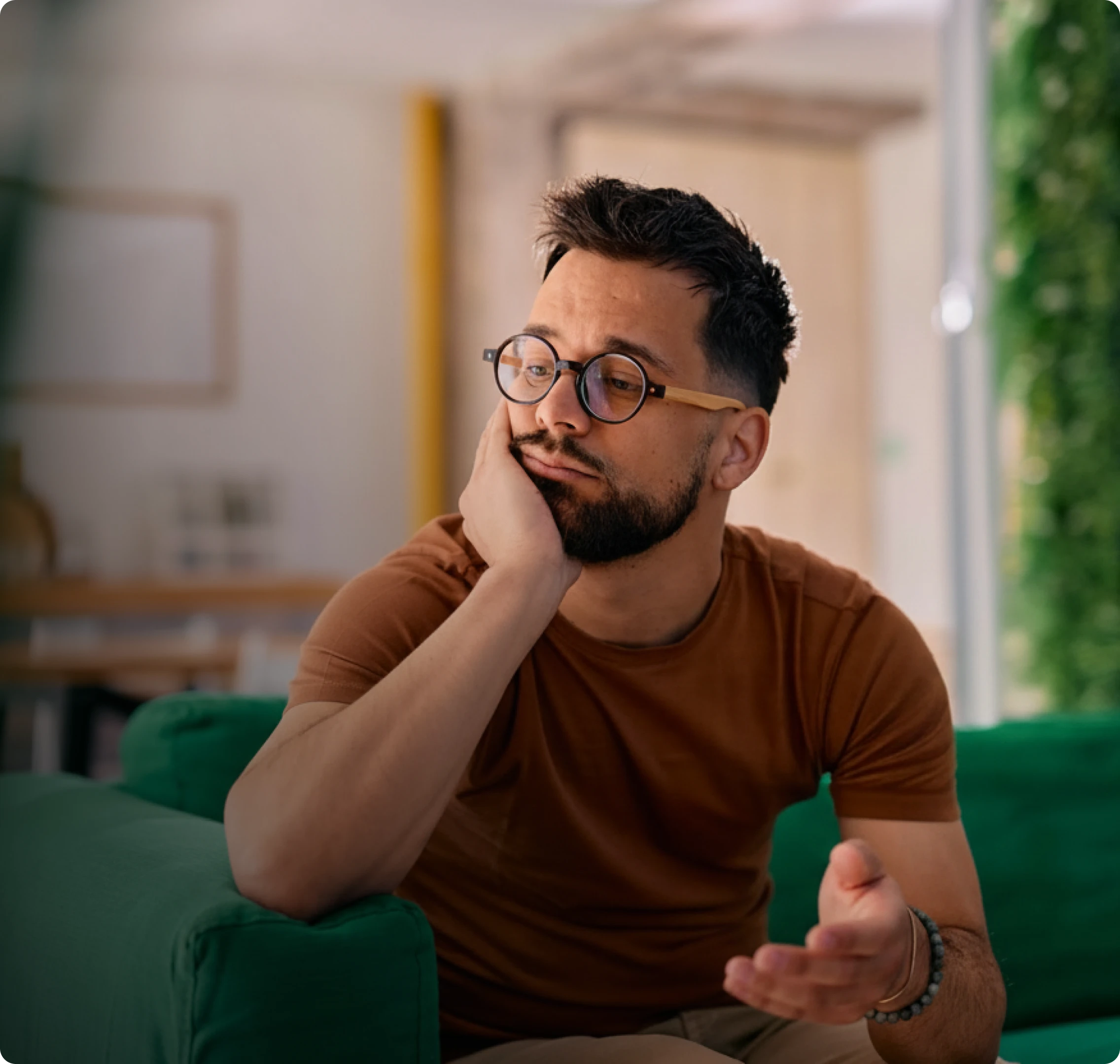 Person quietly struggling, considering getting help